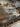 Wholesale liquidation pallet - branded furniture and rolled rug shrink-wrapped in Dallas TX warehouse, bulk resale furniture load